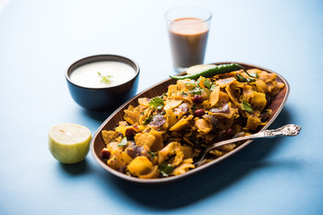 Homemade Kothu Parotta/ Paratha or Stir Fried Leftover Chapati Masala or  fodnichi poli in marathi, served in a bowl or plate with curd and hot tea. Selective focus
