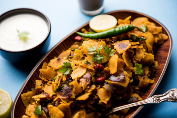 Homemade Kothu Parotta/ Paratha or Stir Fried Leftover Chapati Masala or  fodnichi poli in marathi, served in a bowl or plate with curd and hot tea. Selective focus