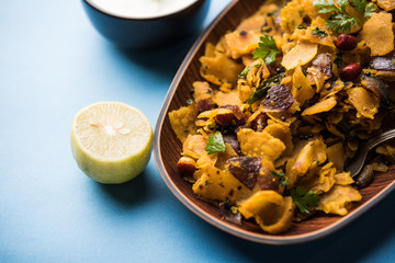 Homemade Kothu Parotta/ Paratha or Stir Fried Leftover Chapati Masala or  fodnichi poli in marathi, served in a bowl or plate with curd and hot tea. Selective focus
