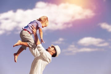 Family happy outside sunset vacation lifestyle hug