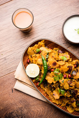 Homemade Kothu Parotta/ Paratha or Stir Fried Leftover Chapati Masala or  fodnichi poli in marathi, served in a bowl or plate with curd and hot tea. Selective focus