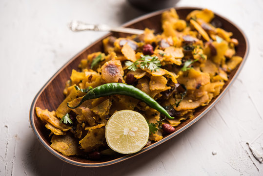 Homemade Kothu Parotta/ Paratha or Stir Fried Leftover Chapati Masala or  fodnichi poli in marathi, served in a bowl or plate with curd and hot tea. Selective focus
