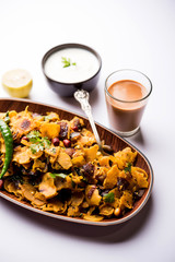 Homemade Kothu Parotta/ Paratha or Stir Fried Leftover Chapati Masala or  fodnichi poli in marathi, served in a bowl or plate with curd and hot tea. Selective focus