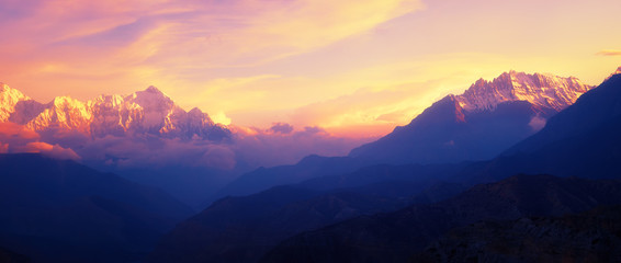 Beautiful panoramic view of a mountain range in the Himalayas during sunset