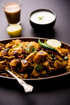 Homemade Kothu Parotta/ Paratha or Stir Fried Leftover Chapati Masala or  fodnichi poli in marathi, served in a bowl or plate with curd and hot tea. Selective focus
