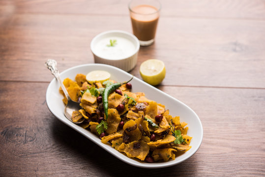 Homemade Kothu Parotta/ Paratha or Stir Fried Leftover Chapati Masala or  fodnichi poli in marathi, served in a bowl or plate with curd and hot tea. Selective focus