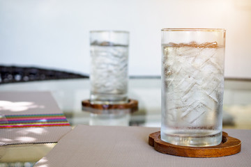 Glasses of cold fresh drink water on table
