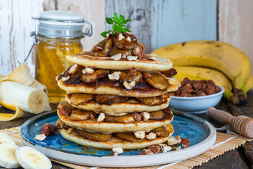 Chocolate-filled pancakes with caramelised bananas, honey and hazelnuts