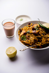 Homemade Kothu Parotta/ Paratha or Stir Fried Leftover Chapati Masala or  fodnichi poli in marathi, served in a bowl or plate with curd and hot tea. Selective focus