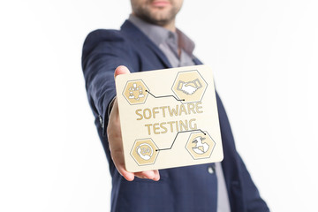 The concept of business, technology, the Internet and the network. Young businessman showing inscription: Software testing