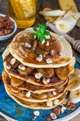 Chocolate-filled pancakes with caramelised bananas, honey and hazelnuts