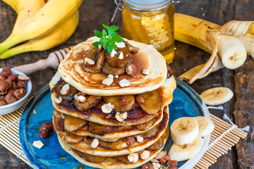 Chocolate-filled pancakes with caramelised bananas, honey and hazelnuts
