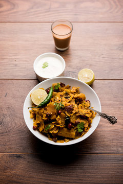 Homemade Kothu Parotta/ Paratha or Stir Fried Leftover Chapati Masala or  fodnichi poli in marathi, served in a bowl or plate with curd and hot tea. Selective focus