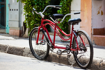Fototapeta na wymiar Bicycle parked at the beautiful streets of the walled city in Cartagena de Indias