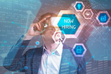 Obraz premium Business, Technology, Internet and network concept. Young businessman working in virtual reality glasses sees the inscription: now hiring