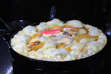 rice and shrimp in a frying pan.