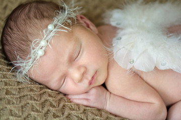 Newborn baby with angel wings