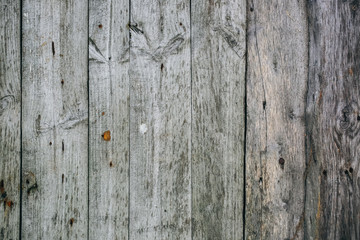 Old vintage wooden planks of the house. Grey wood texture background.