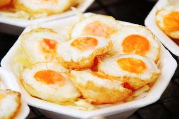 fried eggs with bacon.
