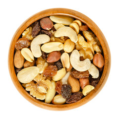 Student food in wooden bowl. Student fodder. Snack mix of dried almonds, cashews, peanuts, walnuts,...
