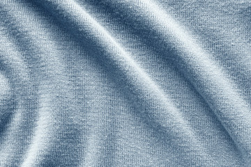 Fototapeta na wymiar Simple knitted fabric stockinette stitch with large folds