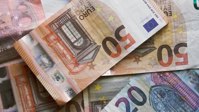 Throw a banknote to a bunch of euro banknotes