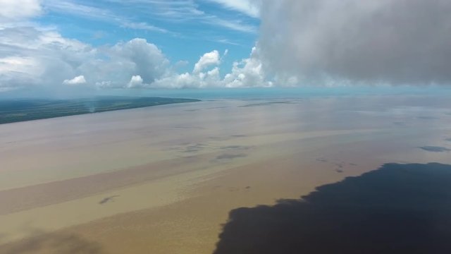 Beautiful aerial landscape Mana river estuary drone view along clouds. Guiana 