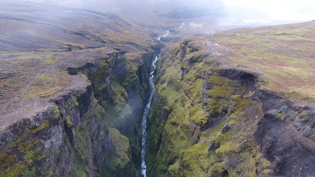 Aerial view of a canyon with a river in Iceland. Glymur waterfall