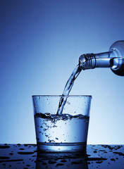 pouring water into a glass