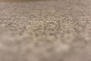 Texture of smooth fabric closeup. Abstract background of the surface of the rug with selective focus.