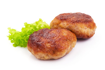 Homemade Roasted meatballs with lettuce, close-up, isolated on a white background