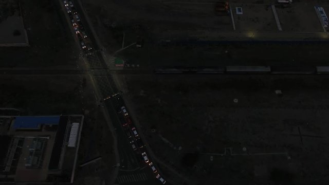 Aerial drone shot during night of a train crossing Ulanbator Mongolia