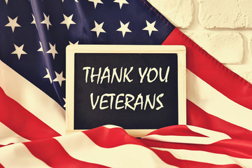 Veterans day remembrance concept. USA flag background. United States of America celebrates armed forces on november 11th. Close up, copy space, top view.
