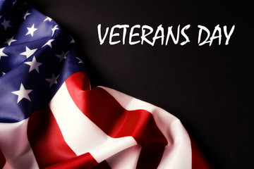 Veterans day remembrance concept. USA flag background. United States of America celebrates armed forces on november 11th. Close up, copy space, top view.