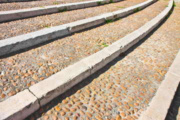 Paving and staircase made with white marble and stone pebbles