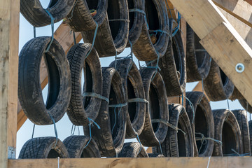 Car tires as climbing obstacle at an obstacle course race