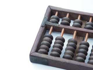 Old and ancient abacus made of wood and attached with a metal plate. On a white background It is a tool for calculating. This is China's first calculator.