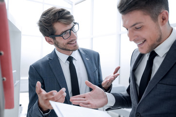 colleagues hold a folder with documents