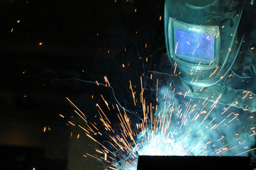 electric welder brews steel at the factory
