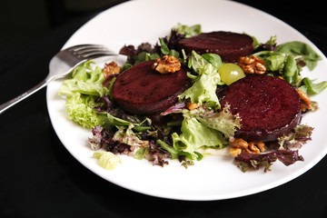 Beetroot steak salad with blue cheese sauce, grapes and walnuts