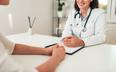 Healthcare and medicine concept. Close-up of doctor and patient in medical office.