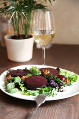 Beetroot steak salad with blue cheese sauce, grapes and walnuts