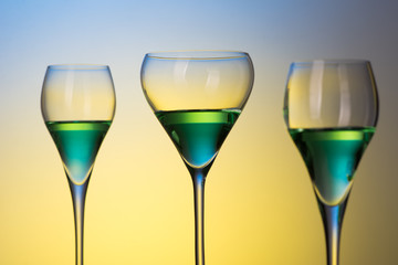 three glasses with cocktails