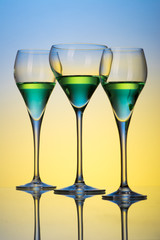 three glasses with cocktails