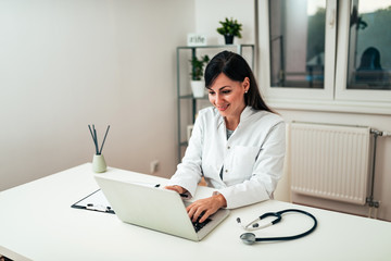 Beautiful female doctor at work.