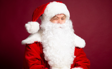 Obraz na płótnie Canvas Happy grandfather Santa Clause portrait isolated on red background