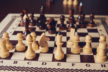 Chess game. Lot of pieces on board.