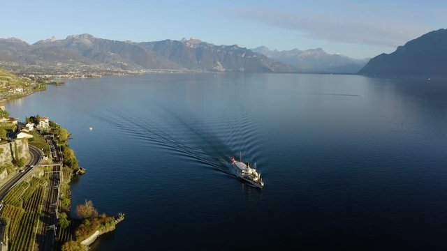 Aerial orbit descending towards CGN Belle-Epoque steam boat on Lake L&radic;&copy;man revealing Rivaz typical village in Lavaux vineyard - Switzerland
Autumn colors and sunset light