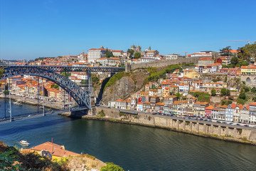 Fototapeta na wymiar Historic Iron Bridge of San Luis over the Douro River. In the city of Porto.