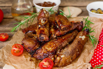 Baked barbecue glazed spare ribs riblets of pork with garlic
